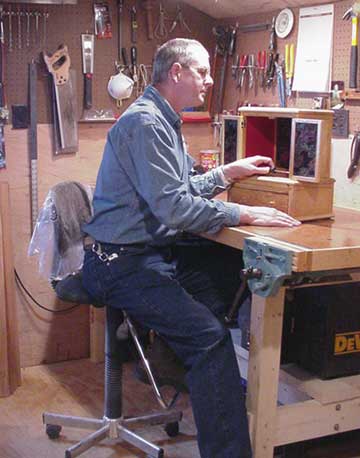 Dave at wook on a Altar in his woodworking shop